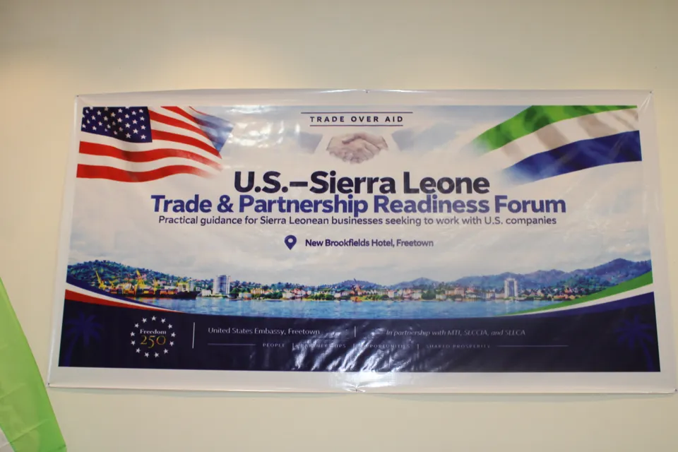 The U.S.-Sierra Leone Trade & Partnership Readiness Forum banner, with Trade Over Aid above the American and Sierra Leonean flags.